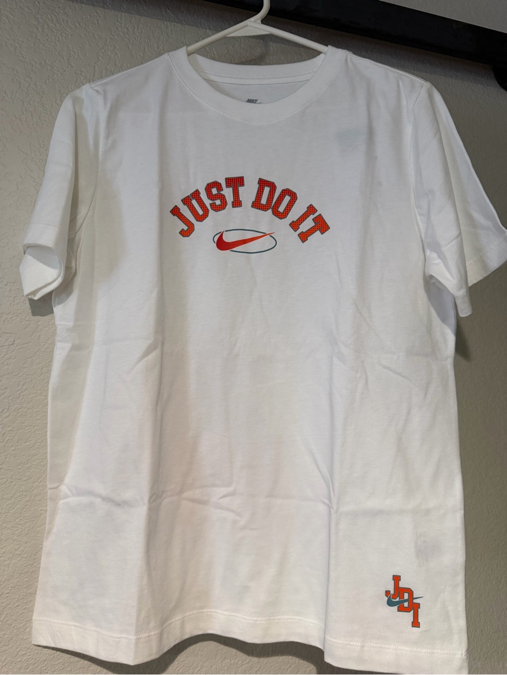 Nike White Short Sleeve Tee with Red-Orange 'Just Do It' Logo